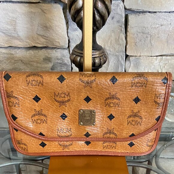 MCM Handbags - MCM Cognac Leather Clutch with Black Logo